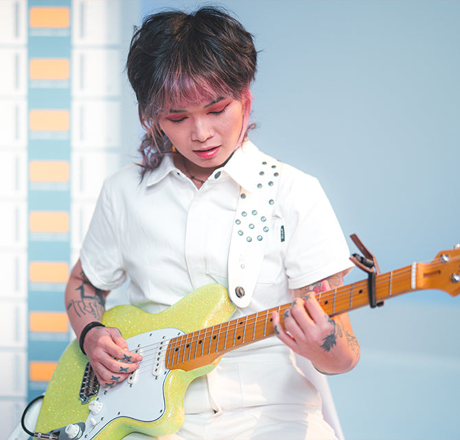 Yvette Young plays her signature Ibanez guitar